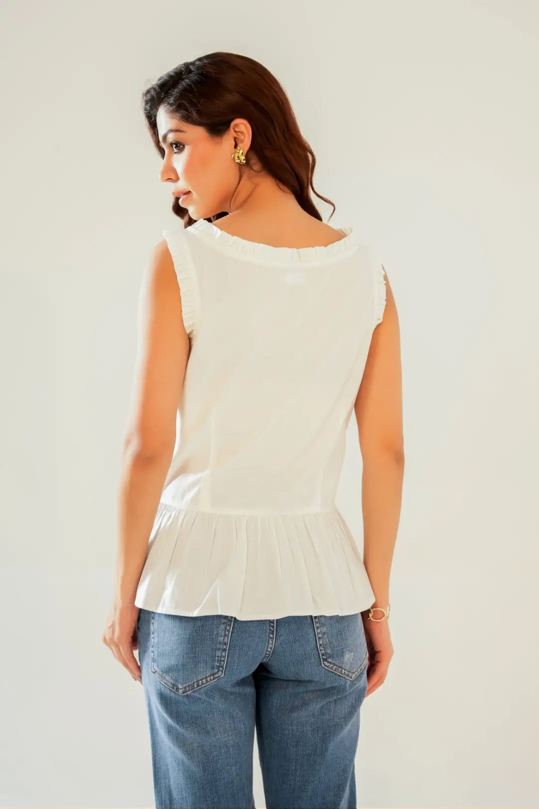 White Sleeveless Peplum Button Up Top with Frill detail